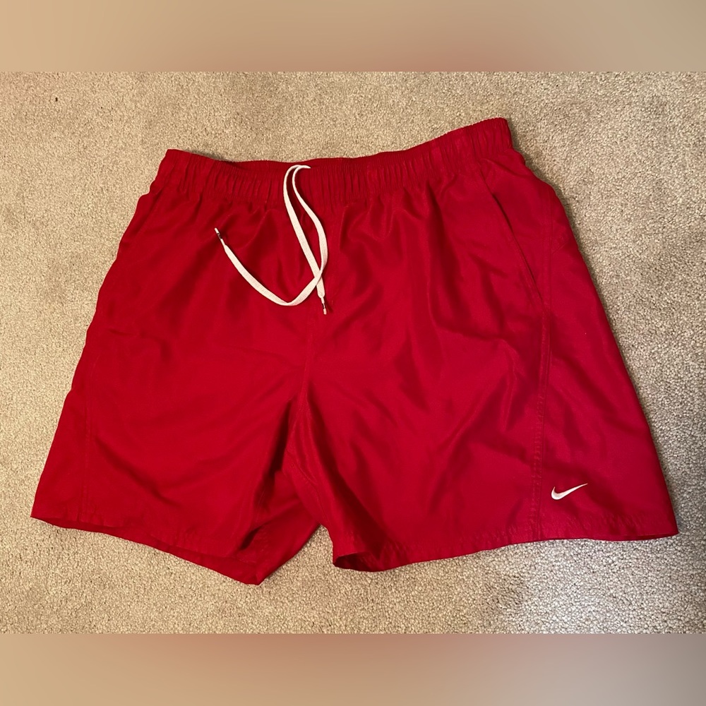 Nike XL men’s swim shorts with mess side pockets and drawstring waist. Red